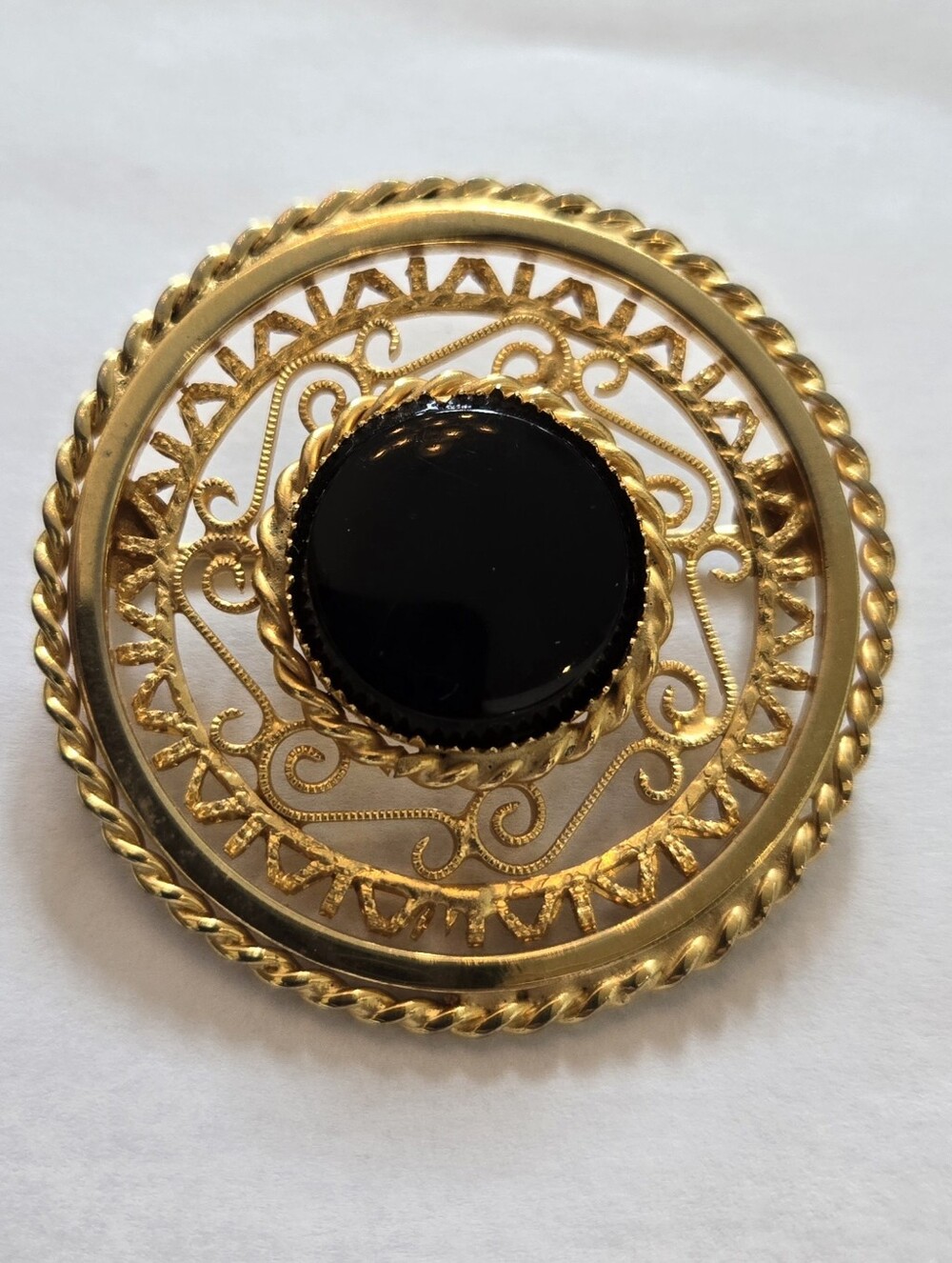 Vintage Gold Tone Filigree Round Brooch Black Cabochon Center Rope Border Pin